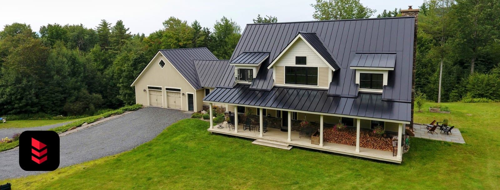 Farmhouse with a black Englert snap-lock standing-seam metal roof
