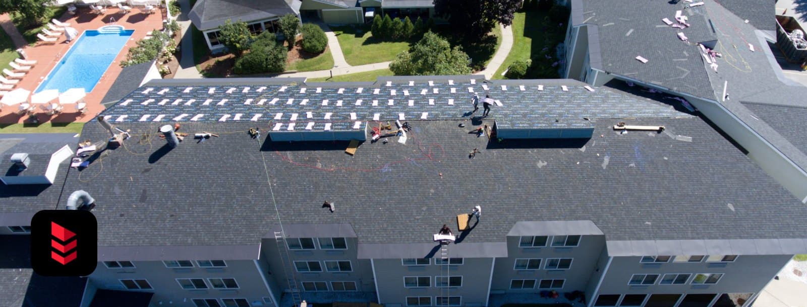 Aerial view of a hotel roof replacement in progress